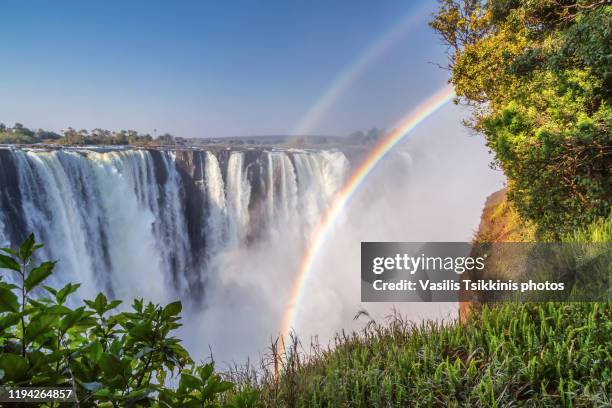 victoria falls with double rainbow - zambezi river stock pictures, royalty-free photos & images