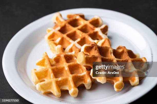 belgian waffles on plate - belgium waffles stock pictures, royalty-free photos & images