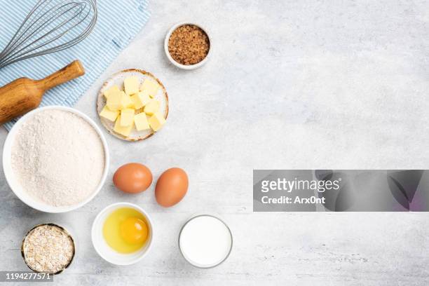 baking ingredients eggs flour butter sugar - butter making fotografías e imágenes de stock