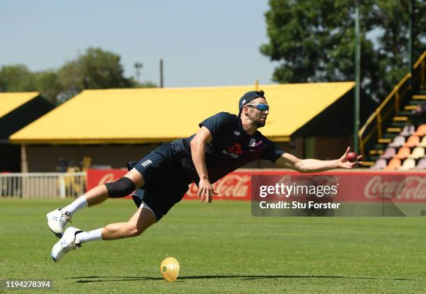 England player Mark Wood dives for a catch during England nets at Willowmoore Park during the England Media Access on December 16, 2019 in Benoni,...