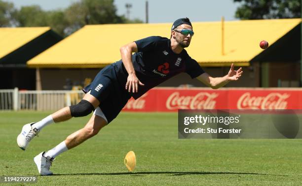 England player Mark Wood dives for a catch during England nets at Willowmoore Park during the England Media Access on December 16, 2019 in Benoni,...