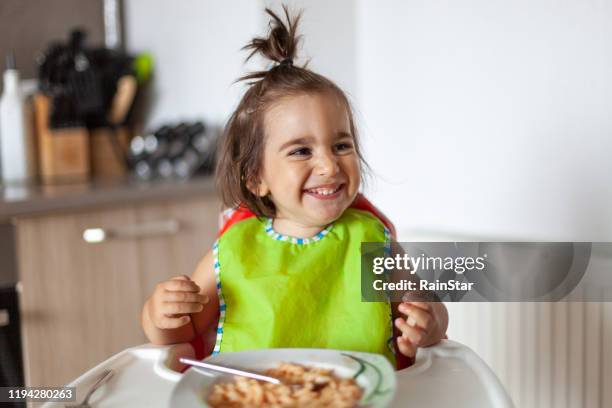 cheerful food - high chair stock pictures, royalty-free photos & images