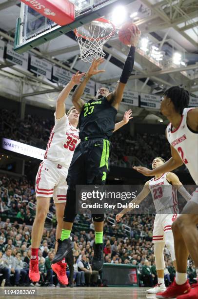 Xavier Tillman of the Michigan State Spartans shoots the ball first half of the game against the Wisconsin Badgers at the Breslin Center on January...