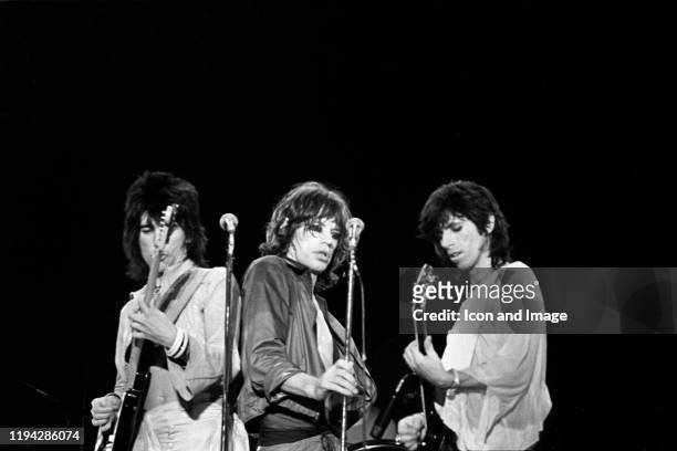 English songwriter and guitarist Ron Wood, English singer, songwriter and lead vocalist Mick Jagger and English singer, songwriter and lead guitarist...