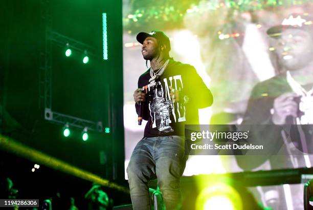 Rapper Pop Smoke performs onstage during day 2 of the Rolling Loud Festival at Banc of California Stadium on December 15, 2019 in Los Angeles,...