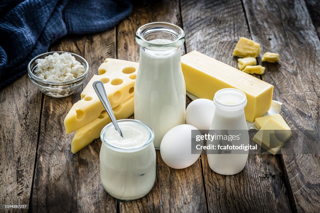 Dairy products on rustic wooden table