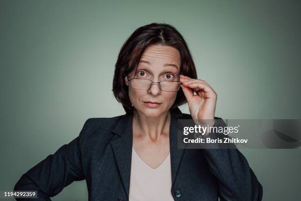 surprised businesswoman - suspicious activity stock pictures, royalty-free photos & images