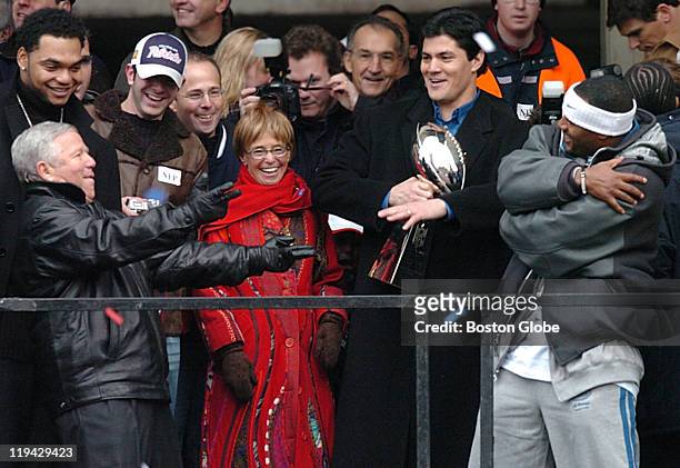 From left to right: Richard Seymour, Robert Kraft, his son Jonathan, and wife Myra; Tedy Bruschi and Ty Law perform the Super Bowl victory dance on...