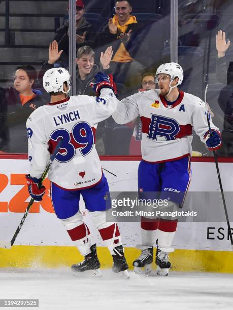 Dale Weise of the Laval Rocket celebrates his goal during the second period with teammate Kevin Lynch against the Cleveland Monsters at Place Bell on...