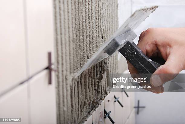 azulejo e pilão - pedreiro imagens e fotografias de stock