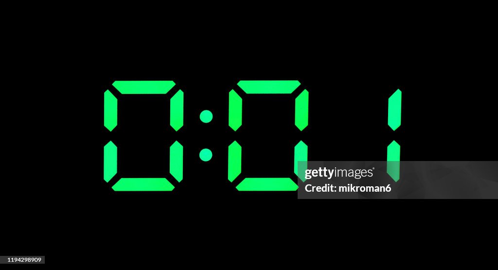 Real green led digital clock showing time 0:01