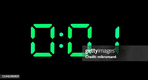 Real green led digital clock showing time 0:01 Real green led digital clock showing time 0:01