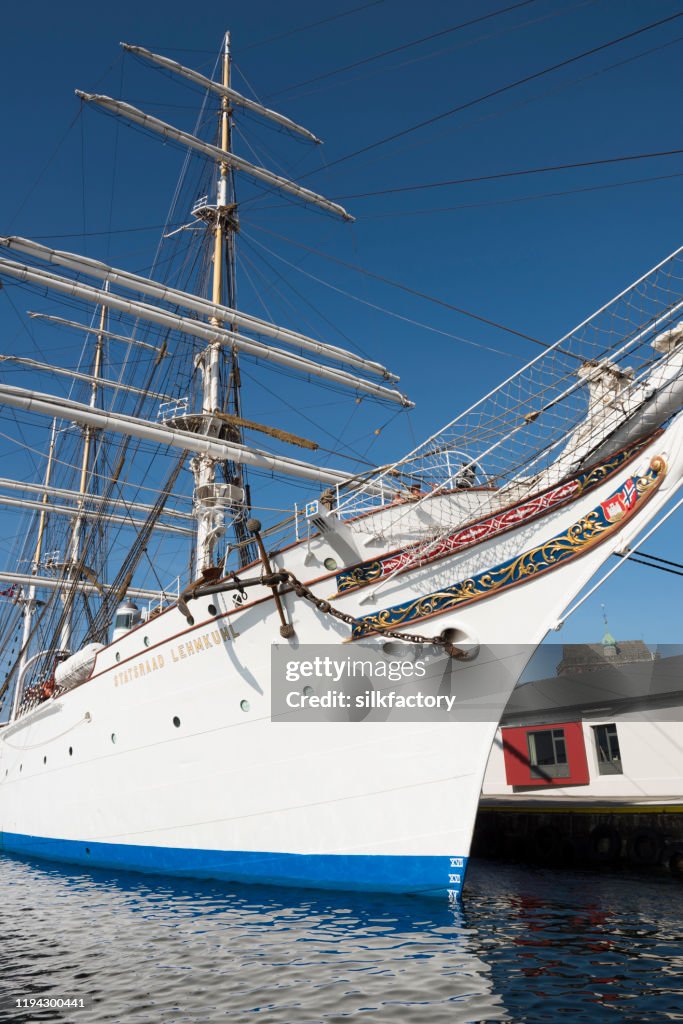 Three-masted barque rigged sail ship Statsraad Lehmkuhl in Vågen Bay in Bergen on sunny day in late summer