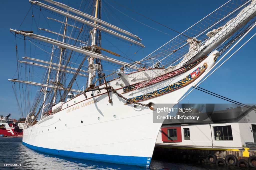 Three-masted barque rigged sail ship Statsraad Lehmkuhl in Vågen Bay in Bergen on sunny day in late summer