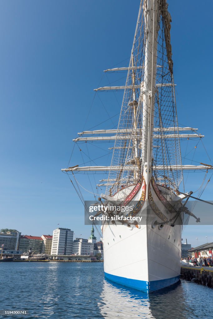 Three-masted barque rigged sail ship Statsraad Lehmkuhl in Vågen Bay in Bergen on sunny day in late summer