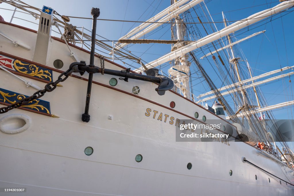 Three-masted barque rigged sail ship Statsraad Lehmkuhl in Vågen Bay in Bergen on sunny day in late summer