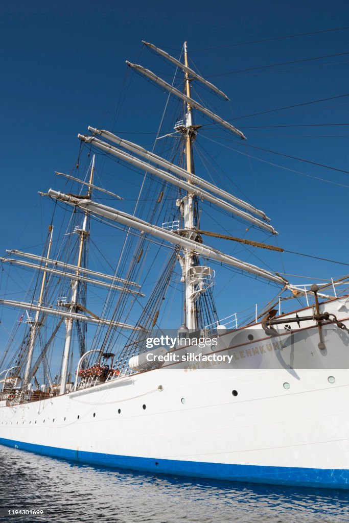 Three-masted barque rigged sail ship Statsraad Lehmkuhl in Vågen Bay in Bergen on sunny day in late summer