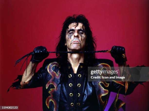 American singer, songwriter, and actor, Alice Cooper, poses backstage at the Cobo Arena during "The Nightmare Returns Tour" on October 30 in Detroit,...