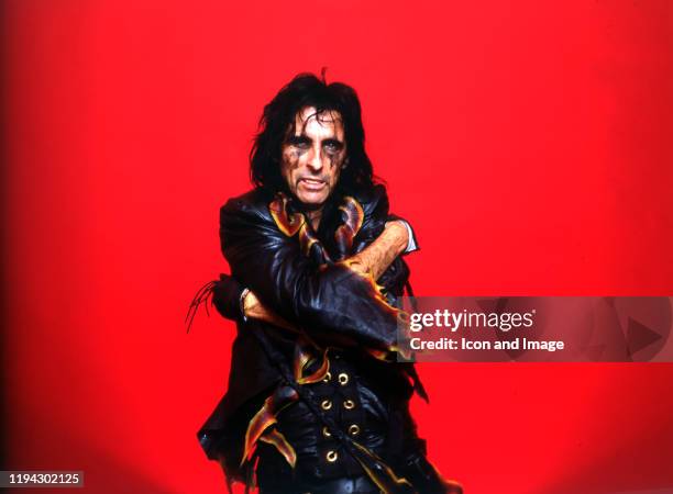 American singer, songwriter, and actor, Alice Cooper, poses backstage at the Cobo Arena during "The Nightmare Returns Tour" on October 30 in Detroit,...