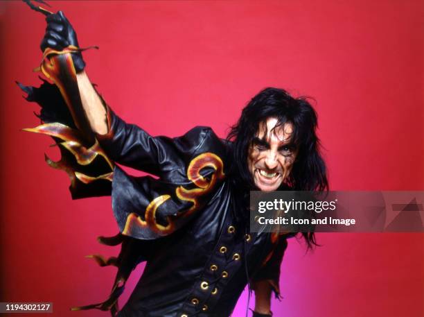American singer, songwriter, and actor, Alice Cooper, poses backstage at the Cobo Arena during "The Nightmare Returns Tour" on October 30 in Detroit,...