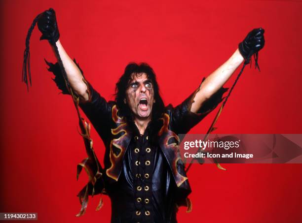 American singer, songwriter, and actor, Alice Cooper, poses backstage at the Cobo Arena during "The Nightmare Returns Tour" on October 30 in Detroit,...