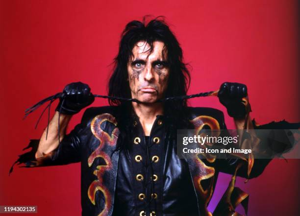 American singer, songwriter, and actor, Alice Cooper, poses backstage at the Cobo Arena during "The Nightmare Returns Tour" on October 30 in Detroit,...