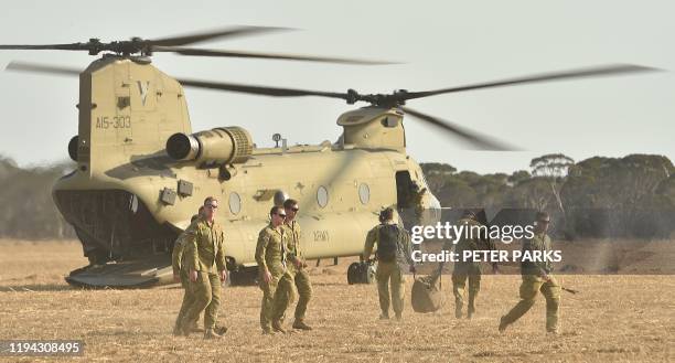 This photo taken on January 16, 2020 shows an Australian Defence Force helicopter landing on Kangaroo Island as part of the deployment of 3,000...