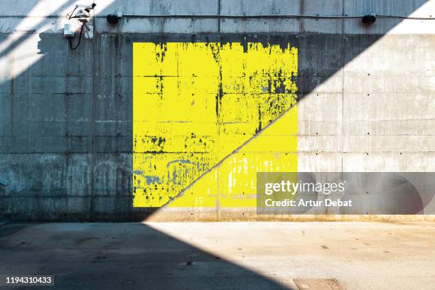 color square geometry painted in minimal urban architecture. - yellow wall stockfoto's en -beelden