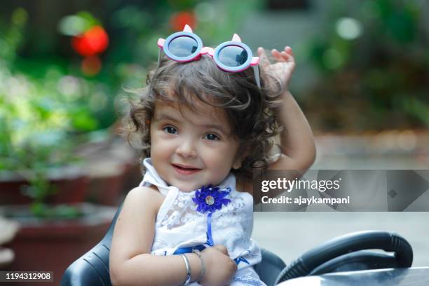 portrait of baby girl with cute expression - baby girls stock pictures, royalty-free photos & images