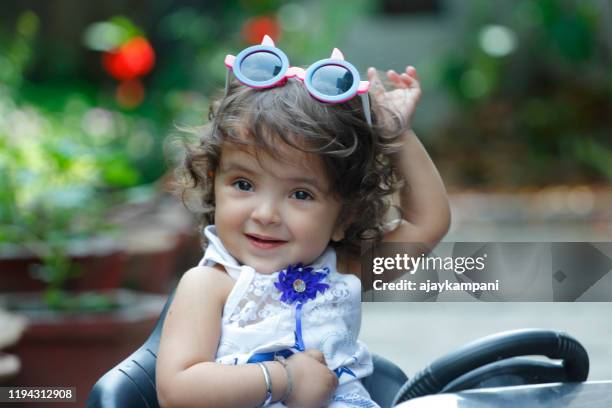 portrait of baby girl  with cute expression - baby girl stock pictures, royalty-free photos & images