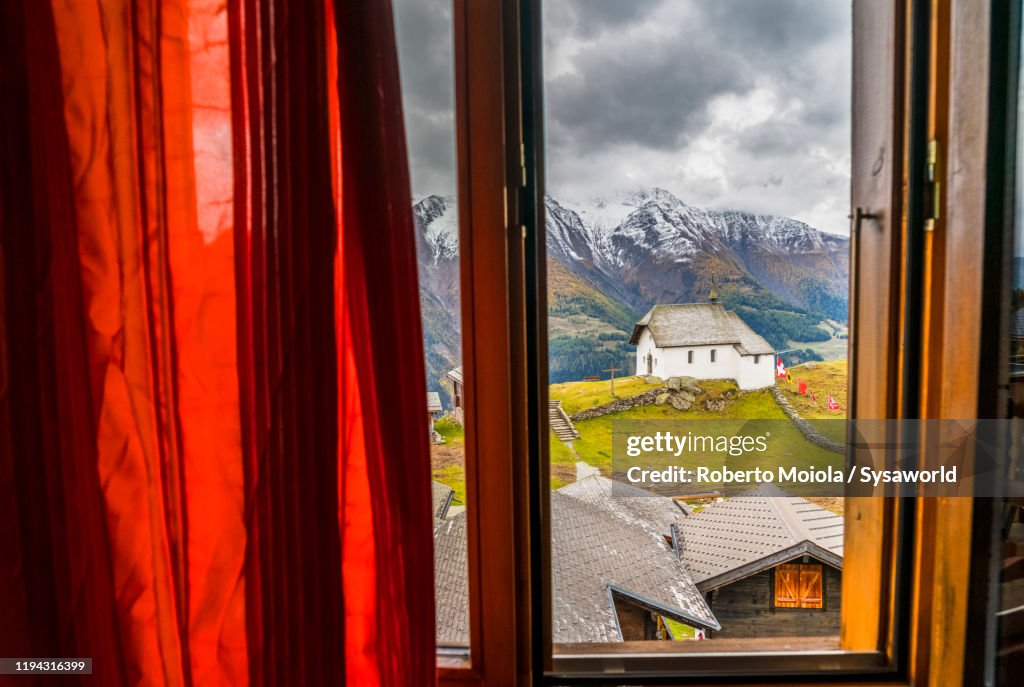 Bettmeralp alpine village view through window, Valais, Switzerland