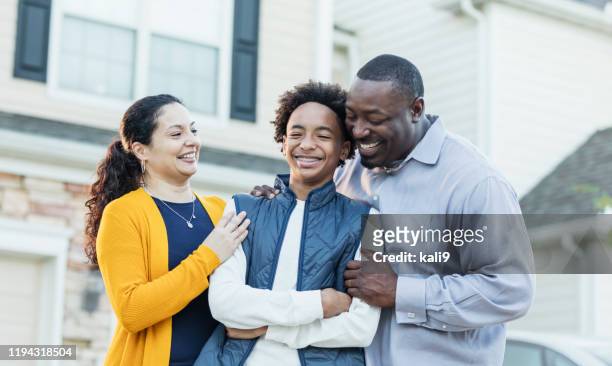 mixed race african-american and hispanic family - parent stock pictures, royalty-free photos & images