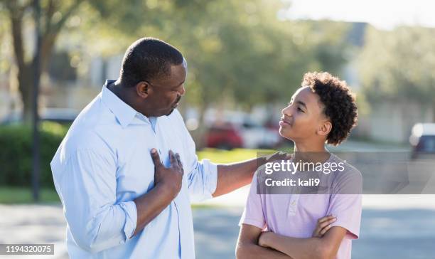 father giving advice to his teenage son - boy talking stock pictures, royalty-free photos & images