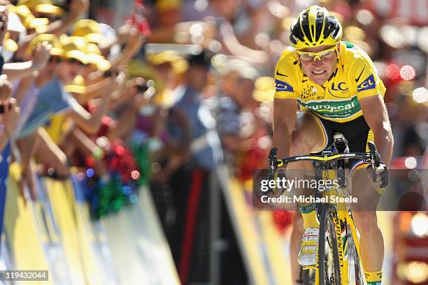 Thomas Voeckler of France and Team Europcar heads to the finishing line to retain the yellow jersey during Stage 17 of the 2011 Tour de France from...