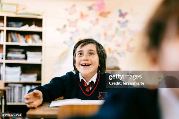 elementary schoolboy in school uniform - portrait indoors stock pictures, royalty-free photos & images