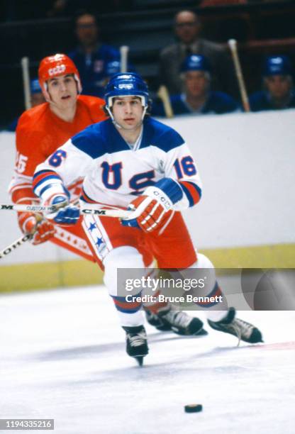 Vladimir Golikov of the USSR battles with Mark Pavelich of Team USA during the 1980 Olympic Games on February 22, 1980 at the Olympic Center in Lake...