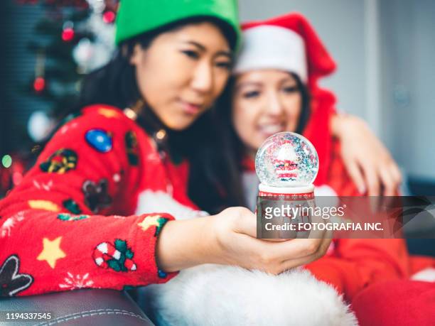 millennial christmas party - funny snow globe stock pictures, royalty-free photos & images