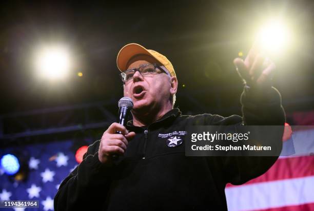 Minnesota Governor Tim Walz introduces Democratic presidential candidate Sen. Amy Klobuchar during a campaign rally at First Avenue on January 17,...