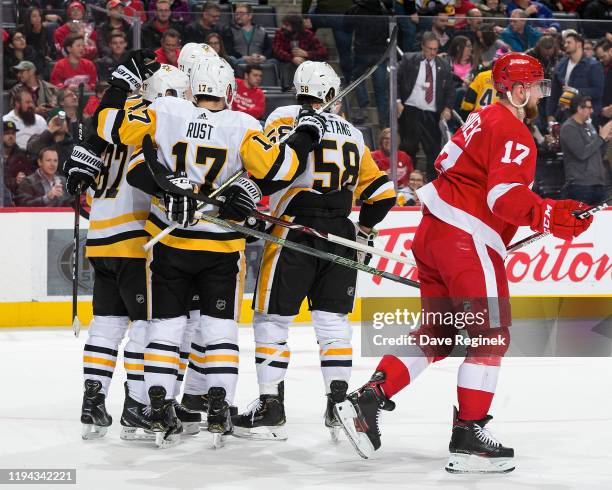 Sidney Crosby of the Pittsburgh Penguins celebrates his overtime goal with teammates Evgeni Malkin, Bryan Rust and Kris Letang in front of Filip...