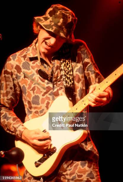 American Rock musician Joe Walsh plays guitar as he performs onstage at the Poplar Creek Music Theater, Hoffman Estates, Illinois, June 12, 1981.