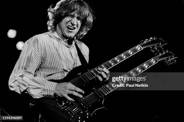 American Rock musician Joe Walsh plays guitar as he performs onstage during Chicagofest, Chicago, Illinois, August 21, 1983.