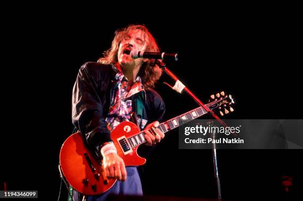 American Rock musician Joe Walsh plays guitar as he performs onstage at the Alpine Valley Music Theater, East Troy, Wisconsin, July 1, 1989.