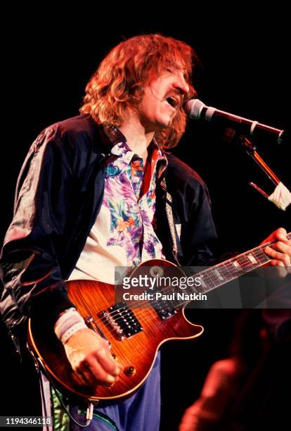 American Rock musician Joe Walsh plays guitar as he performs onstage at the Alpine Valley Music Theater, East Troy, Wisconsin, July 1, 1989.