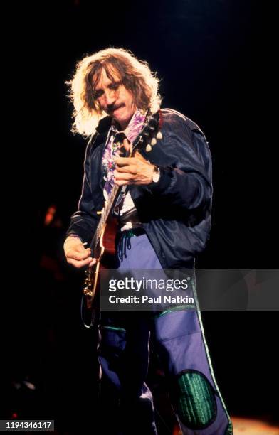 American Rock musician Joe Walsh plays guitar as he performs onstage at the Alpine Valley Music Theater, East Troy, Wisconsin, July 1, 1989.