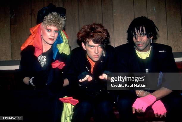 Portrait of members of the English New Wave group Thompson Twins as they pose backstage at the Aragon Ballroom, Chicago, Illinois, April 27, 1984....