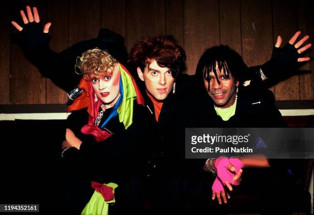 Portrait of members of the English New Wave group Thompson Twins as they pose backstage at the Aragon Ballroom, Chicago, Illinois, April 27, 1984....