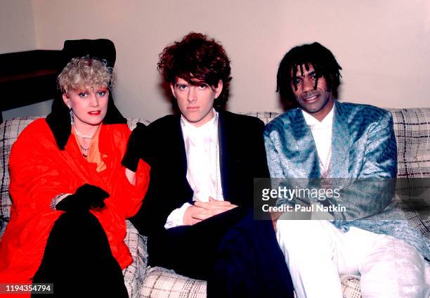 Portrait of members of the English New Wave group Thompson Twins as they pose backstage at the Poplar Creek Music Theater, Hoffman Estates, Illinois,...