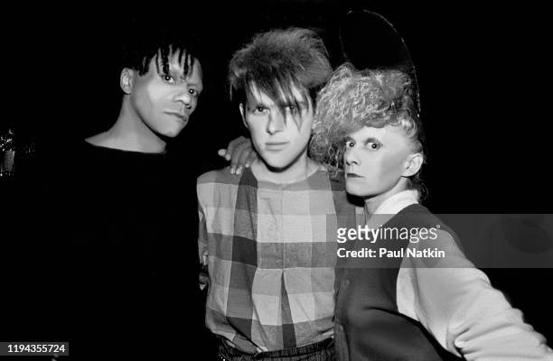 Portrait of members of the English New Wave group Thompson Twins as they pose backstage at the Park West, Chicago, Illinois, November 21, 1982....