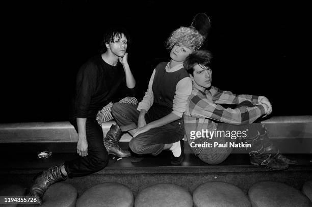 Portrait of members of the English New Wave group Thompson Twins as they pose backstage at the Park West, Chicago, Illinois, November 21, 1982....