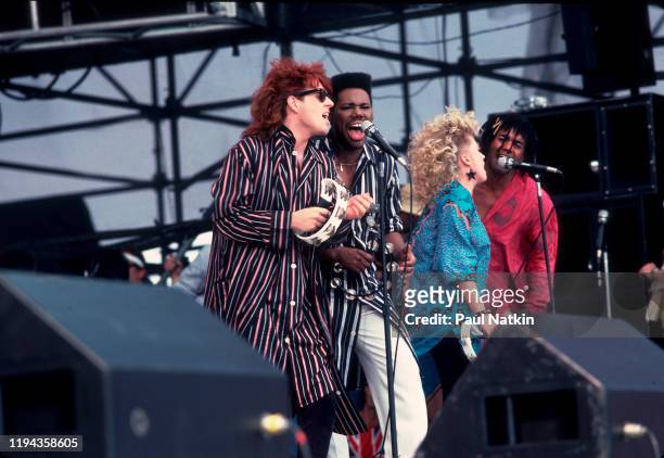 American Rock, Pop, and Funk musician Nile Rogers and the members of English New Wave group Thompson Twins perform as Madonna's special guests during...